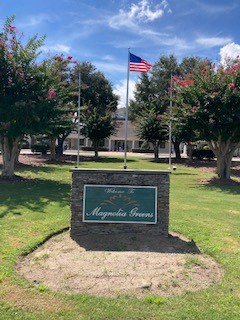 Post 68 raises flag for Magnolia Greens